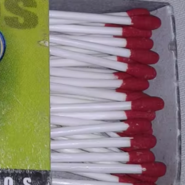 High-quality Red Head Wax Match Stick Wholesalers in India Close-up of a red head wax match stick for lighting candles, diyas, and fireplaces in India